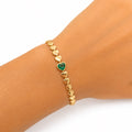 Yellow Gold Heart Chain Bracelet with Emerald Heart Center