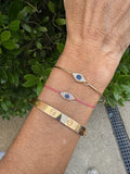 Diamond and Yellow Gold Evil Eye Bangle